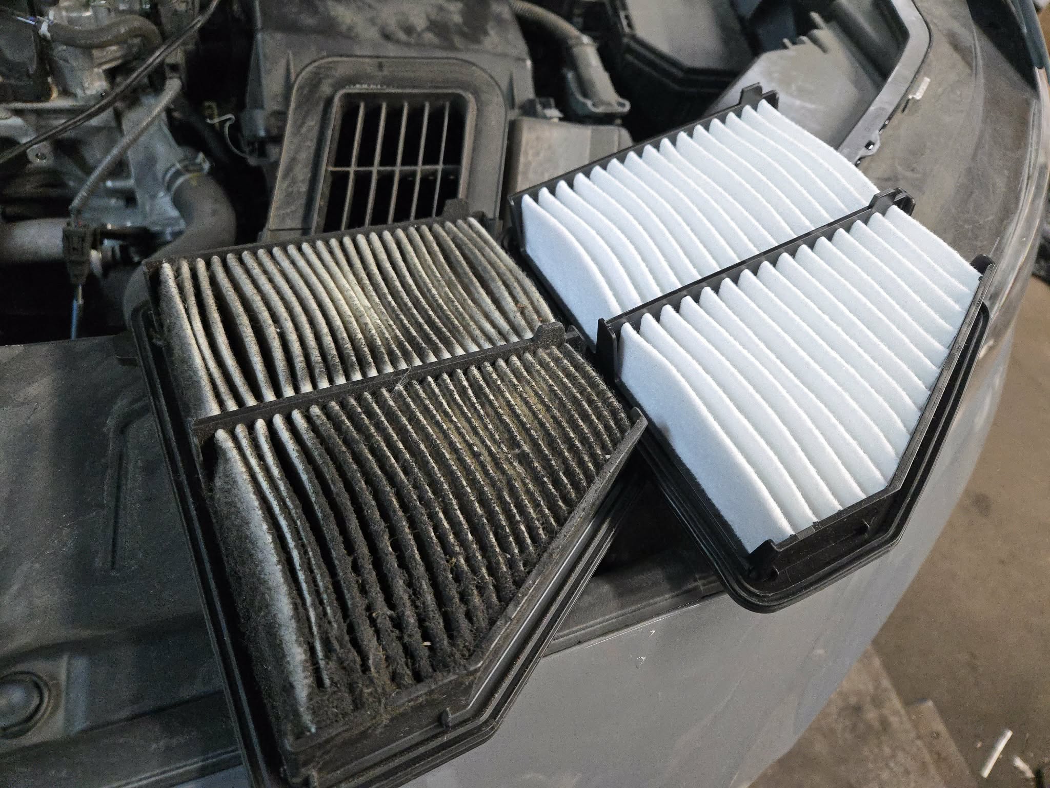 Side by side comparison of a heavily clogged cabin air filter and a brand new clean replacement at POCO NAPA AUTOPRO