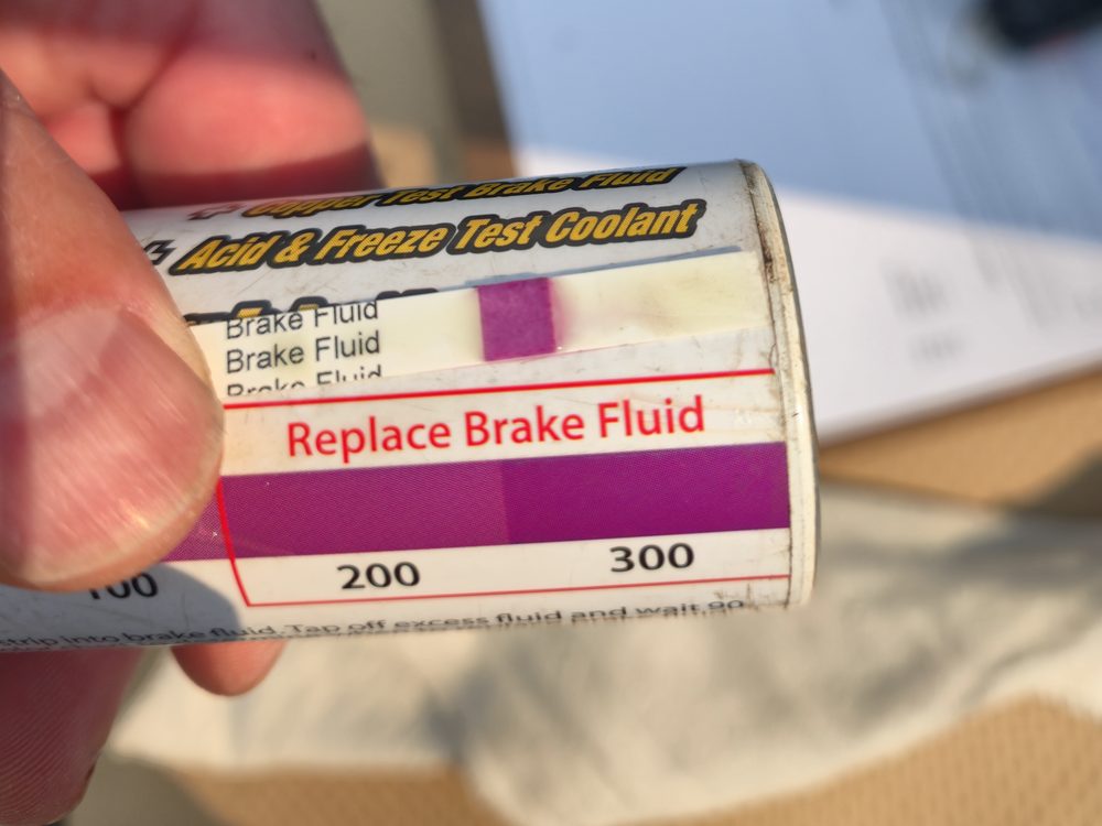 Brake fluid test strip reading in the "Replace Brake Fluid" range at POCO NAPA AUTOPRO in Port Coquitlam