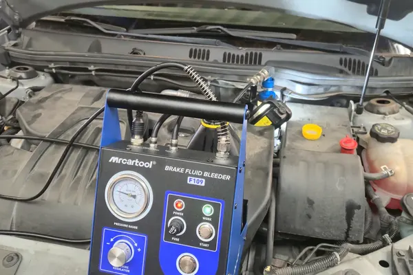 Brake fluid flush machine connected to a vehicle at POCO NAPA AUTOPRO